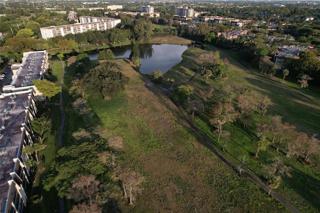 6100 Northwest 44th Street, Unit 307 Lauderhill, FL 33319 - Photo 53 of 54 an aerial view of residential houses with outdoor space and swimming pool