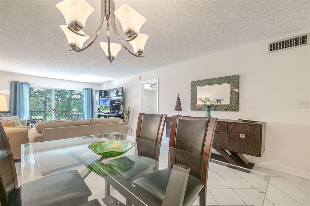 6100 Northwest 44th Street, Unit 307 Lauderhill, FL 33319 - Photo 9 of 54 a living room with furniture