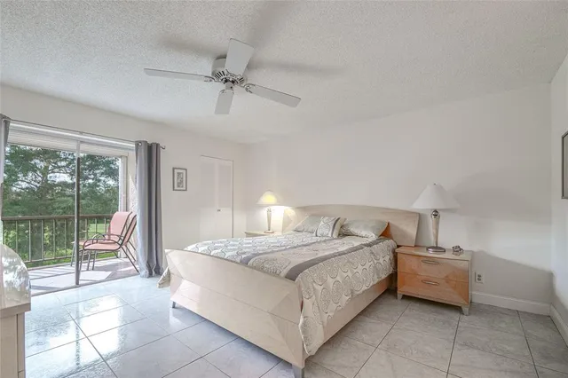 a bedroom with a bed and a lamp