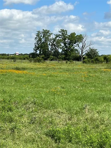 a view of lawn chairs and an ocean view