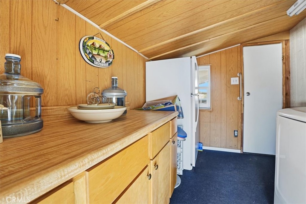 23456 Ottawa Road, Unit 92 Apple Valley, CA 92308 - Photo 26 of 38 Large Laundry Room/Pantry/Storage and Xtra Refrigerator area.