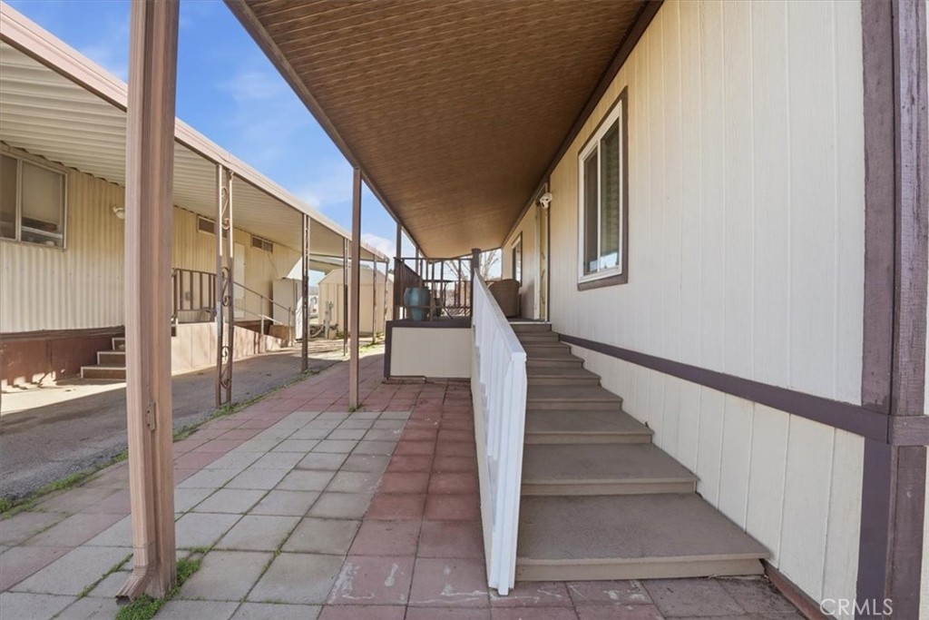 23456 Ottawa Road, Unit 92 Apple Valley, CA 92308 - Photo 31 of 38 Covered Patio and Front entrance.
