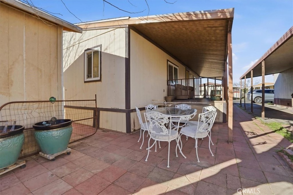 23456 Ottawa Road, Unit 92 Apple Valley, CA 92308 - Photo 33 of 38 Extended brick walkway in patio area