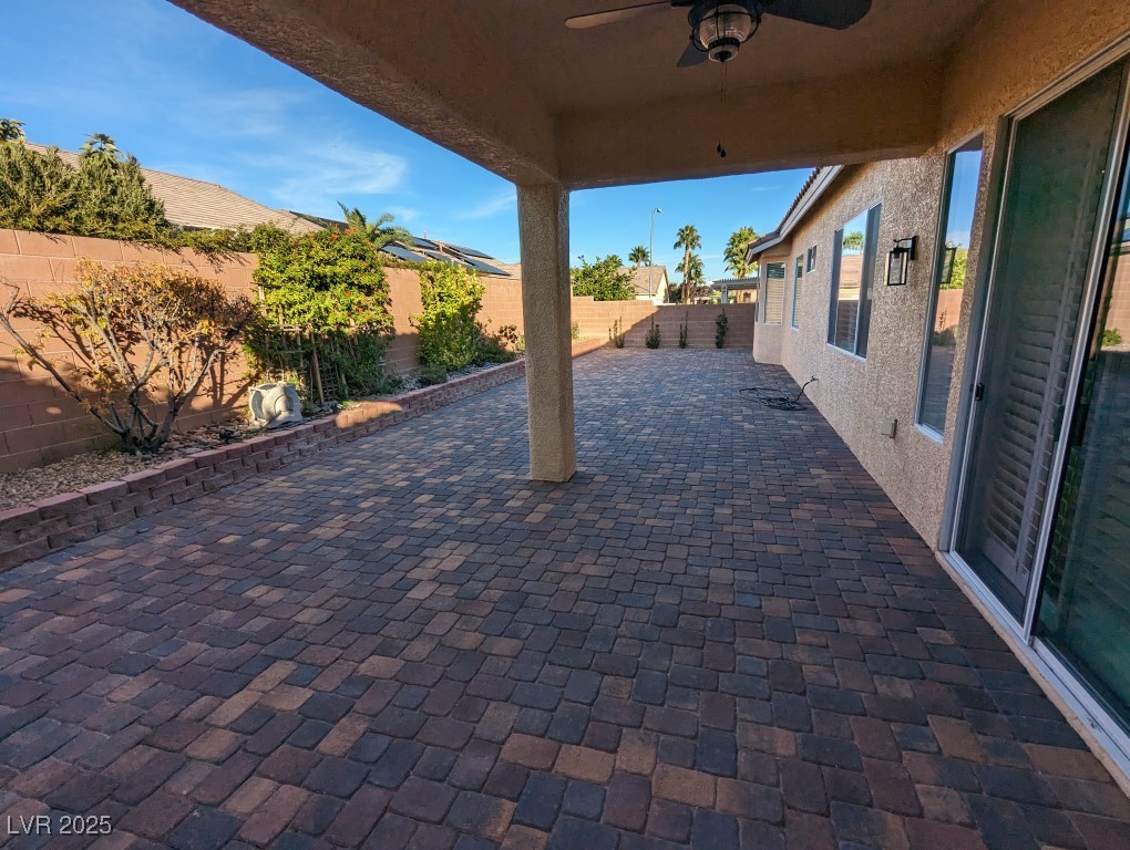 9976 Liberty View Road Las Vegas, NV 89148 - Photo 10 of 44 Fenced backyard with a ceiling fan and a patio
