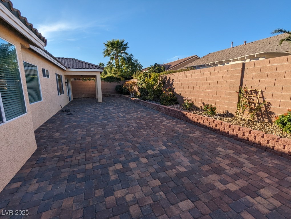 9976 Liberty View Road Las Vegas, NV 89148 - Photo 11 of 44 Fenced backyard featuring a patio area