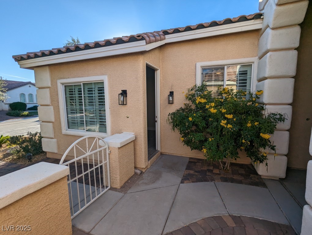 9976 Liberty View Road Las Vegas, NV 89148 - Photo 12 of 44 Entrance to property with stucco siding and a tile roof