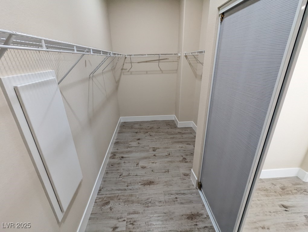 9976 Liberty View Road Las Vegas, NV 89148 - Photo 18 of 44 Spacious closet with light wood-style flooring