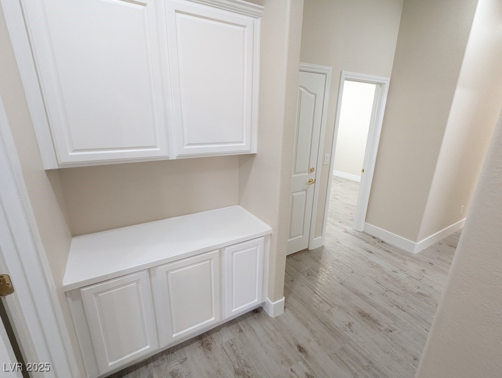 9976 Liberty View Road Las Vegas, NV 89148 - Photo 20 of 44 Hall featuring light wood-style flooring and baseboards