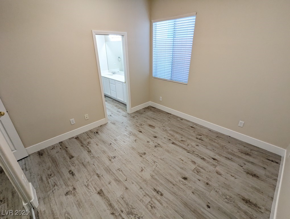 9976 Liberty View Road Las Vegas, NV 89148 - Photo 28 of 44 Empty room with light wood-type flooring and baseboards