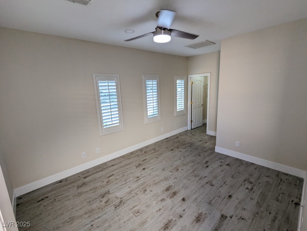 9976 Liberty View Road Las Vegas, NV 89148 - Photo 33 of 44 Unfurnished room featuring wood finished floors and a ceiling fan
