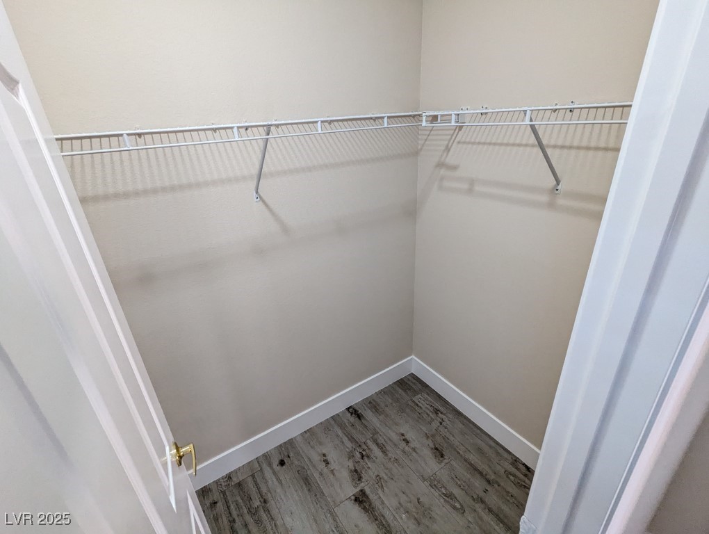 9976 Liberty View Road Las Vegas, NV 89148 - Photo 37 of 44 Walk in closet with wood finished floors