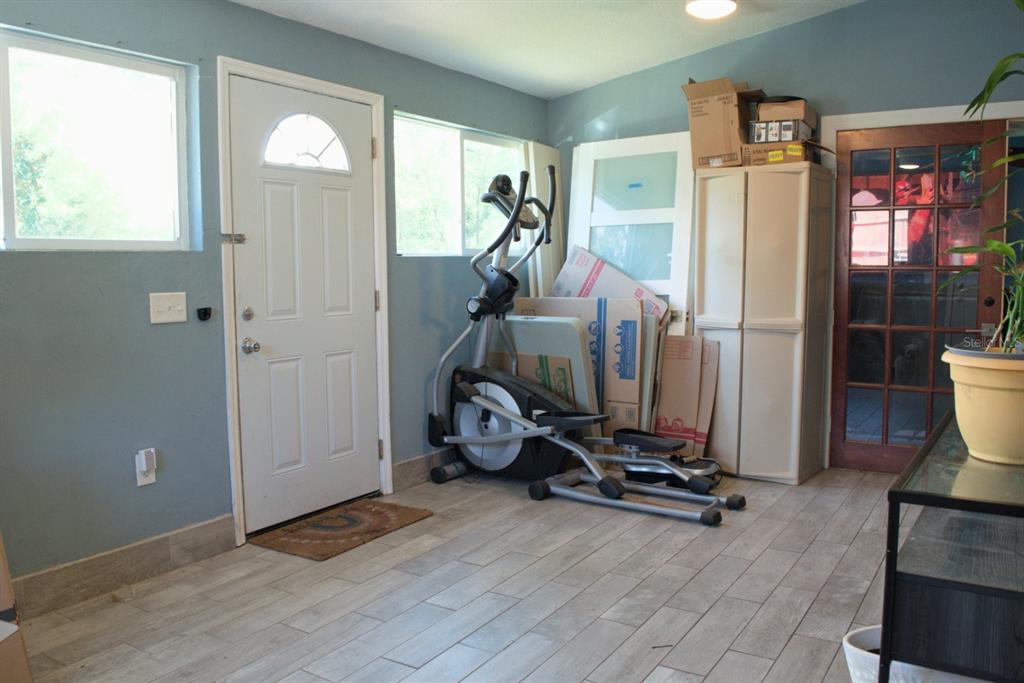 10607 Fernando Street Orlando, FL 32825 - Photo 3 of 19 a view of a room with gym equipment