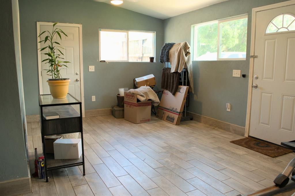 10607 Fernando Street Orlando, FL 32825 - Photo 4 of 19 a living room with furniture and a window