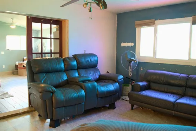 a living room with furniture and a window