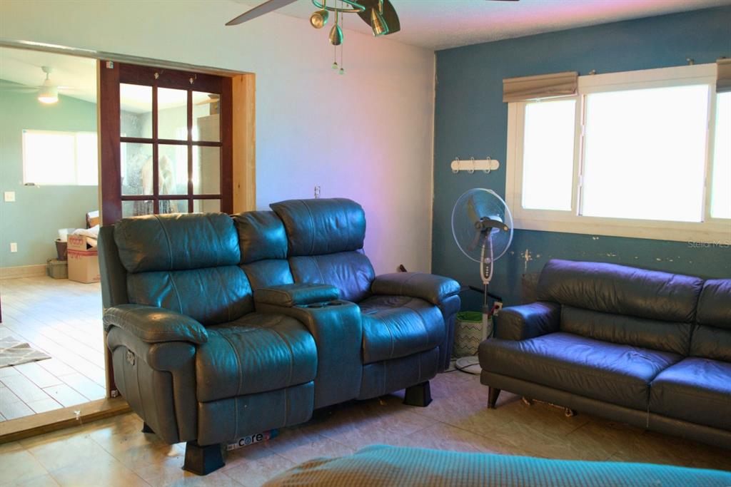 10607 Fernando Street Orlando, FL 32825 - Photo 7 of 19 a living room with furniture and a window