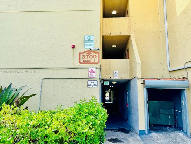 a bathroom with a shower and a potted plant