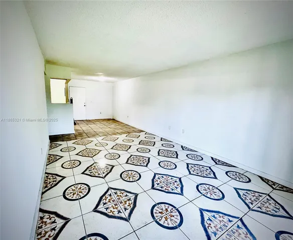 a kitchen with a stove and a refrigerator
