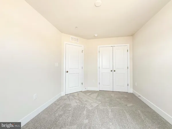 a bathroom with a granite countertop sink and a bathtub