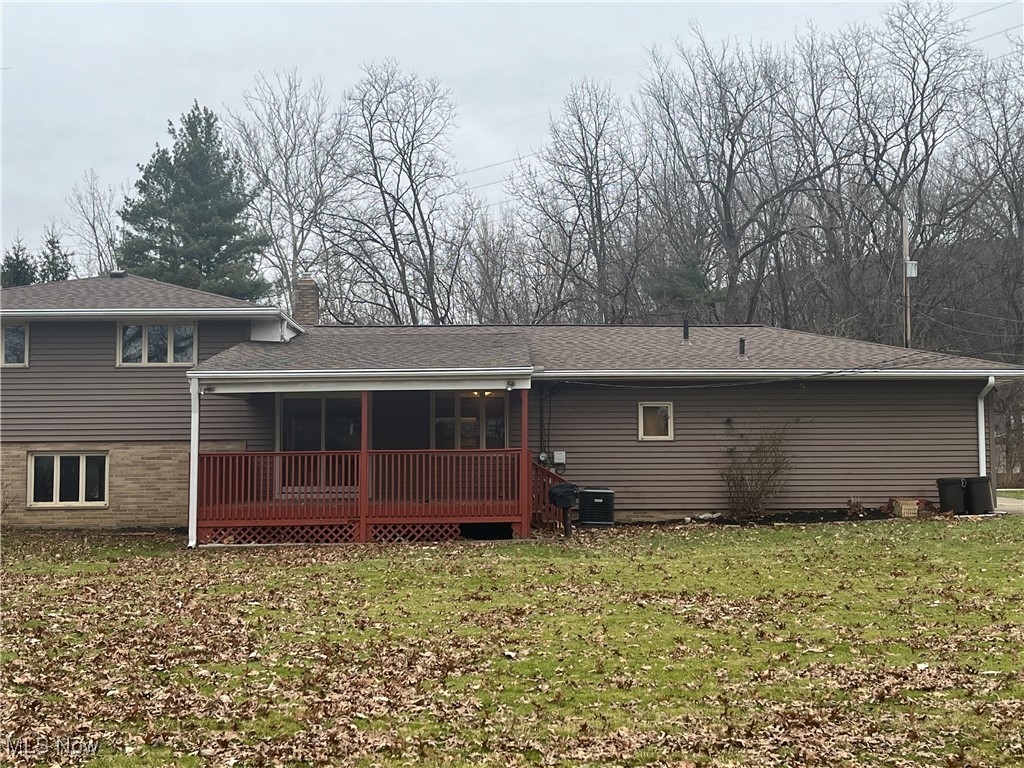 9152 Fosdick Road Cleveland, OH 44125 - Photo 35 of 45 Back of property features a Deck, the backyard, and a newer Roof (2024).