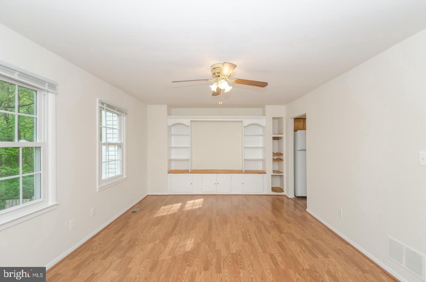 1822 Foxdale Court Crofton, MD 21114 - Photo 17 of 38 wooden floor in an empty room with a window