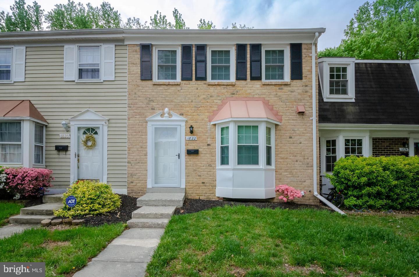 1822 Foxdale Court Crofton, MD 21114 - Photo 2 of 38 a front view of a house with garden