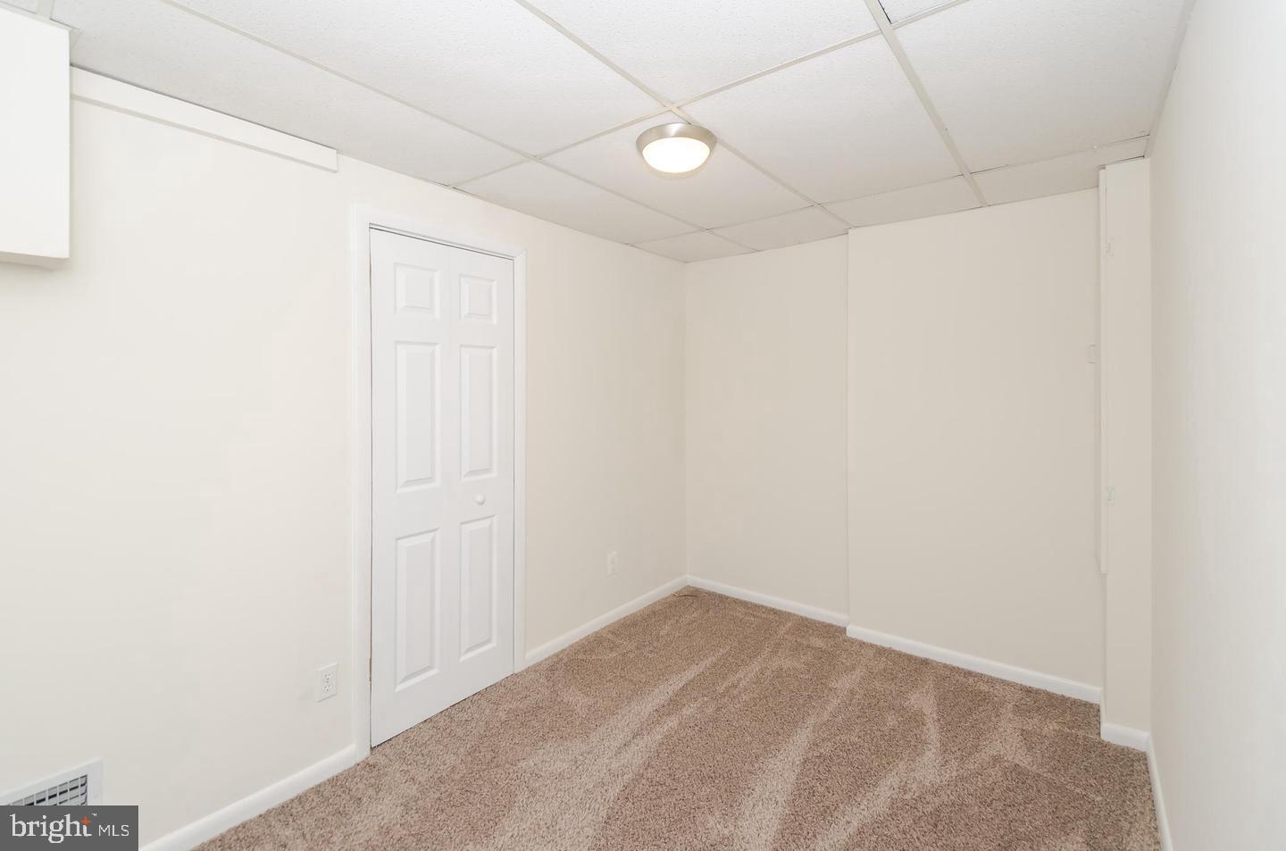 1822 Foxdale Court Crofton, MD 21114 - Photo 31 of 38 a view of a room with a white wall and a window