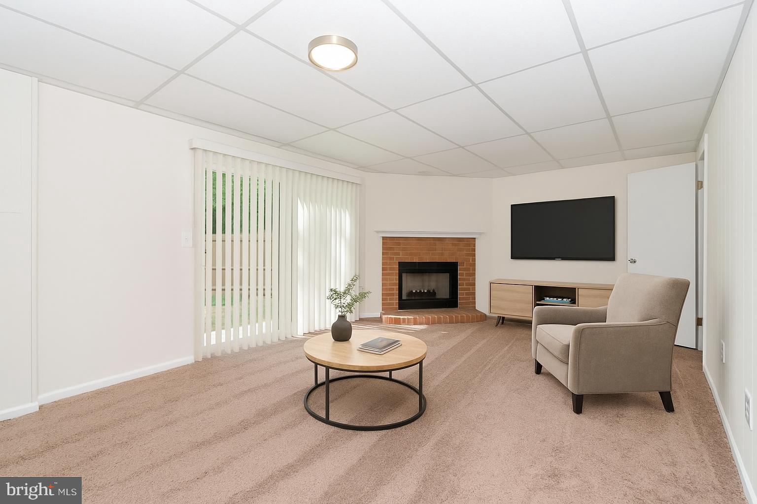 1822 Foxdale Court Crofton, MD 21114 - Photo 6 of 38 a living room with furniture a flat screen tv and a fireplace