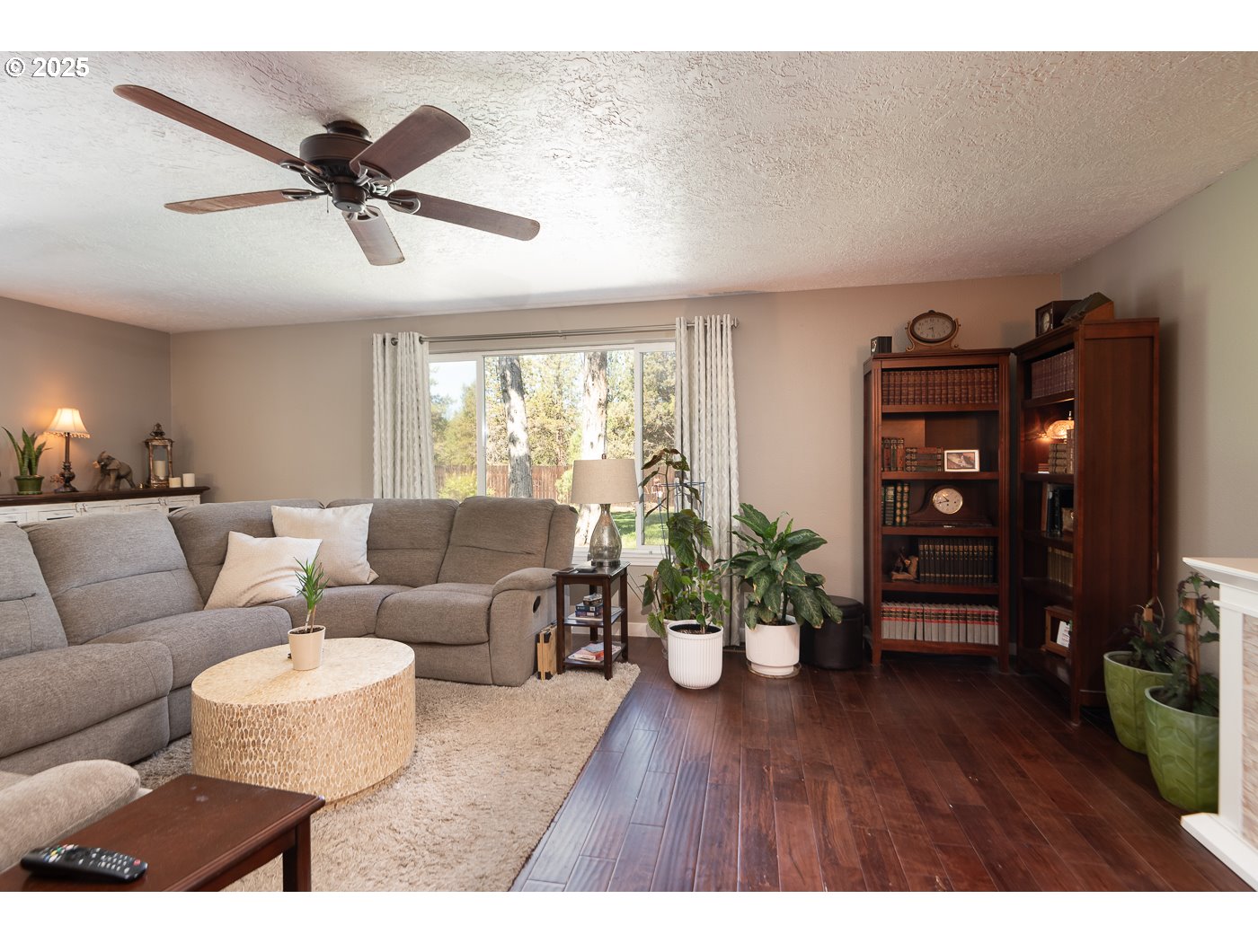 60811 Windsor Drive Bend, OR 97702 - Photo 11 of 27 a living room with furniture and wooden floor