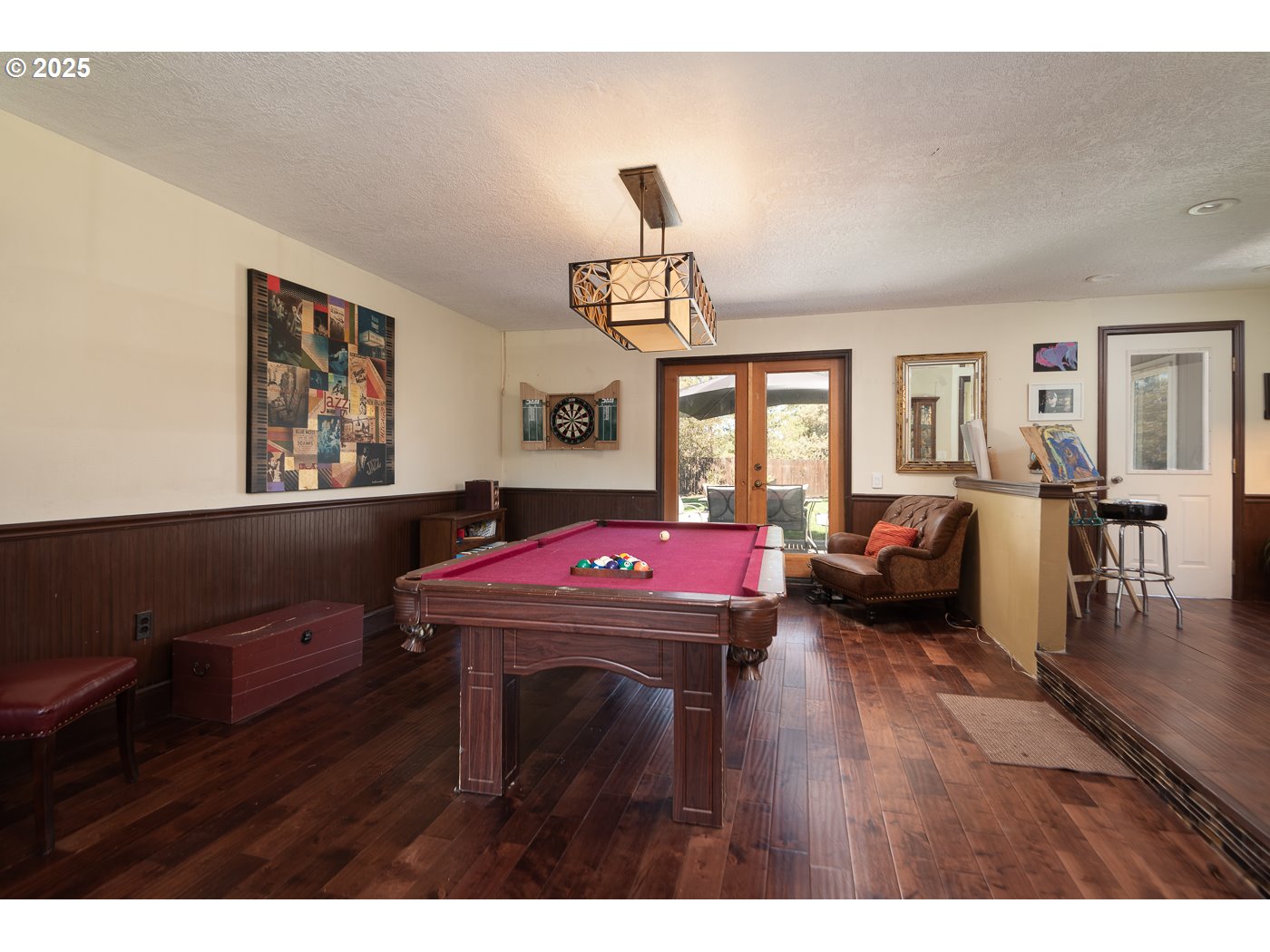 60811 Windsor Drive Bend, OR 97702 - Photo 16 of 27 a living room with furniture a window and a chandelier
