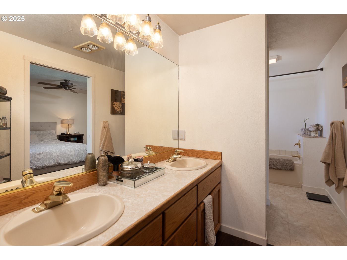 60811 Windsor Drive Bend, OR 97702 - Photo 21 of 27 a bathroom with a sink and a mirror