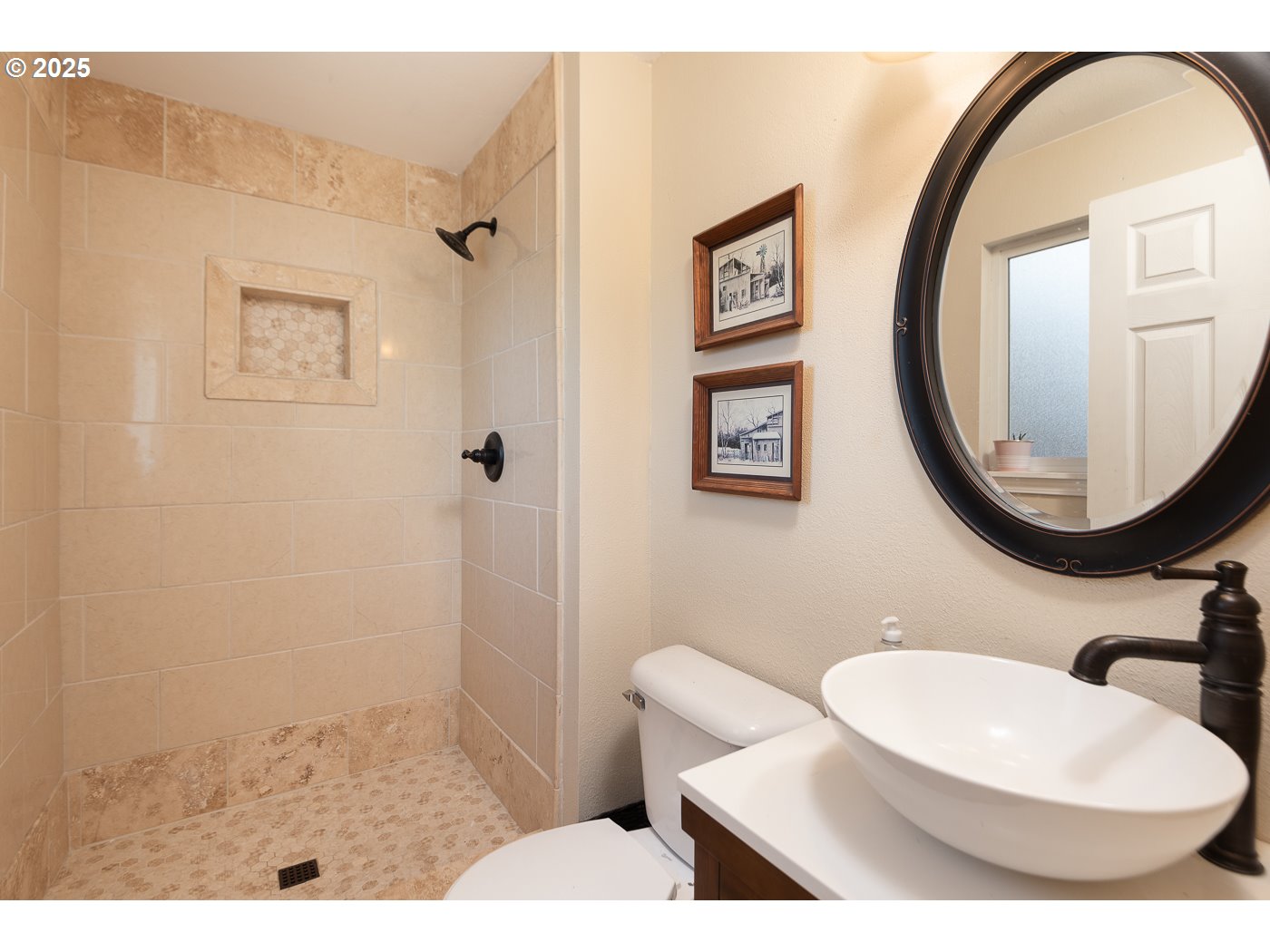 60811 Windsor Drive Bend, OR 97702 - Photo 23 of 27 a bathroom with a toilet a sink and a mirror