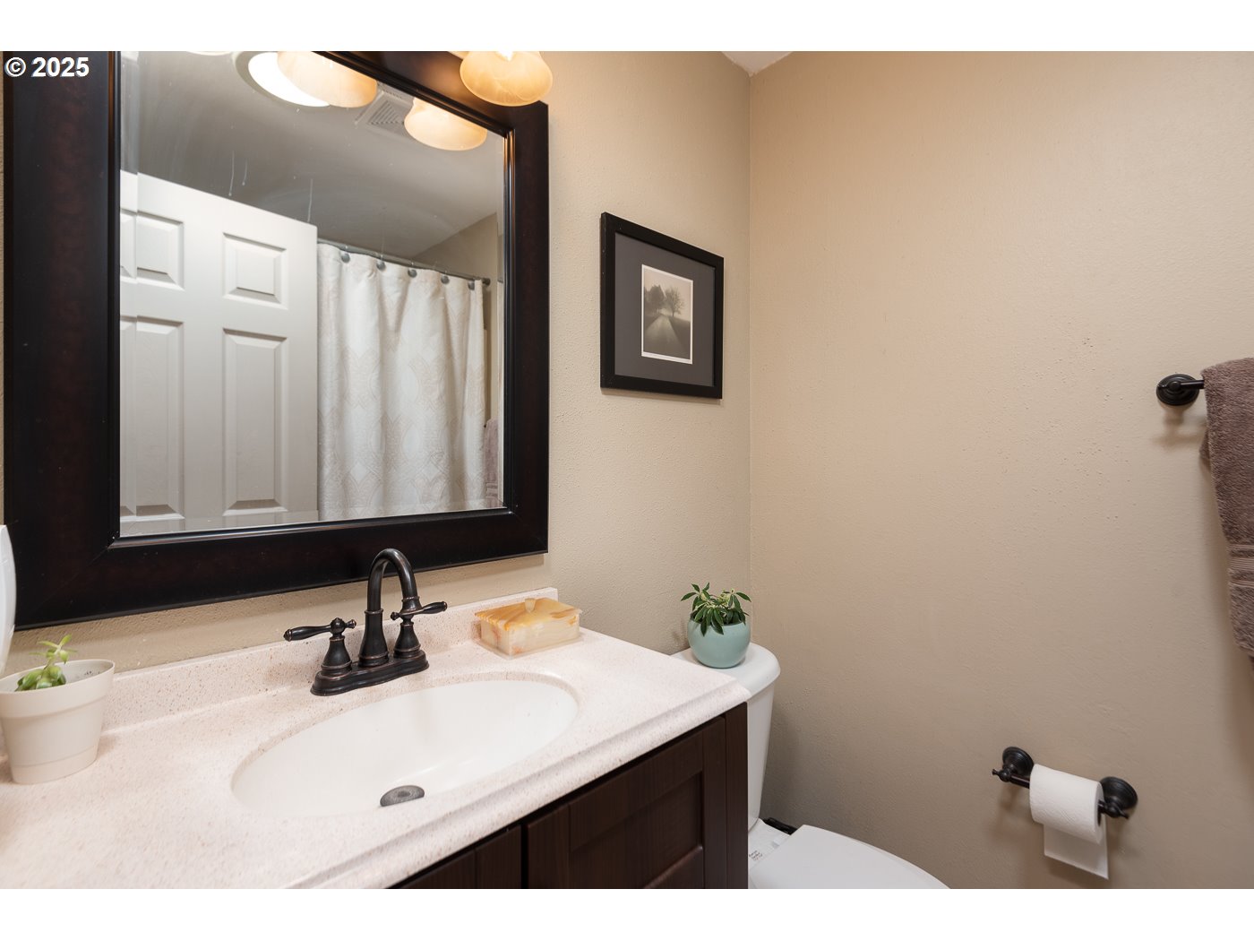 60811 Windsor Drive Bend, OR 97702 - Photo 24 of 27 a bathroom with a sink and a mirror