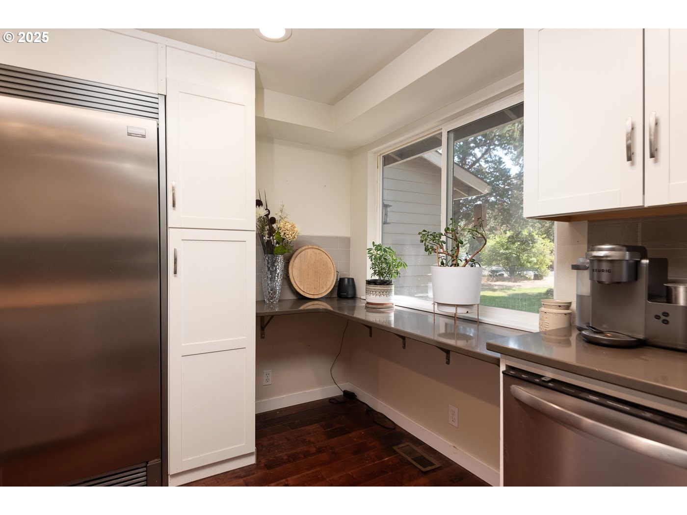 60811 Windsor Drive Bend, OR 97702 - Photo 8 of 27 a kitchen with a refrigerator and a sink
