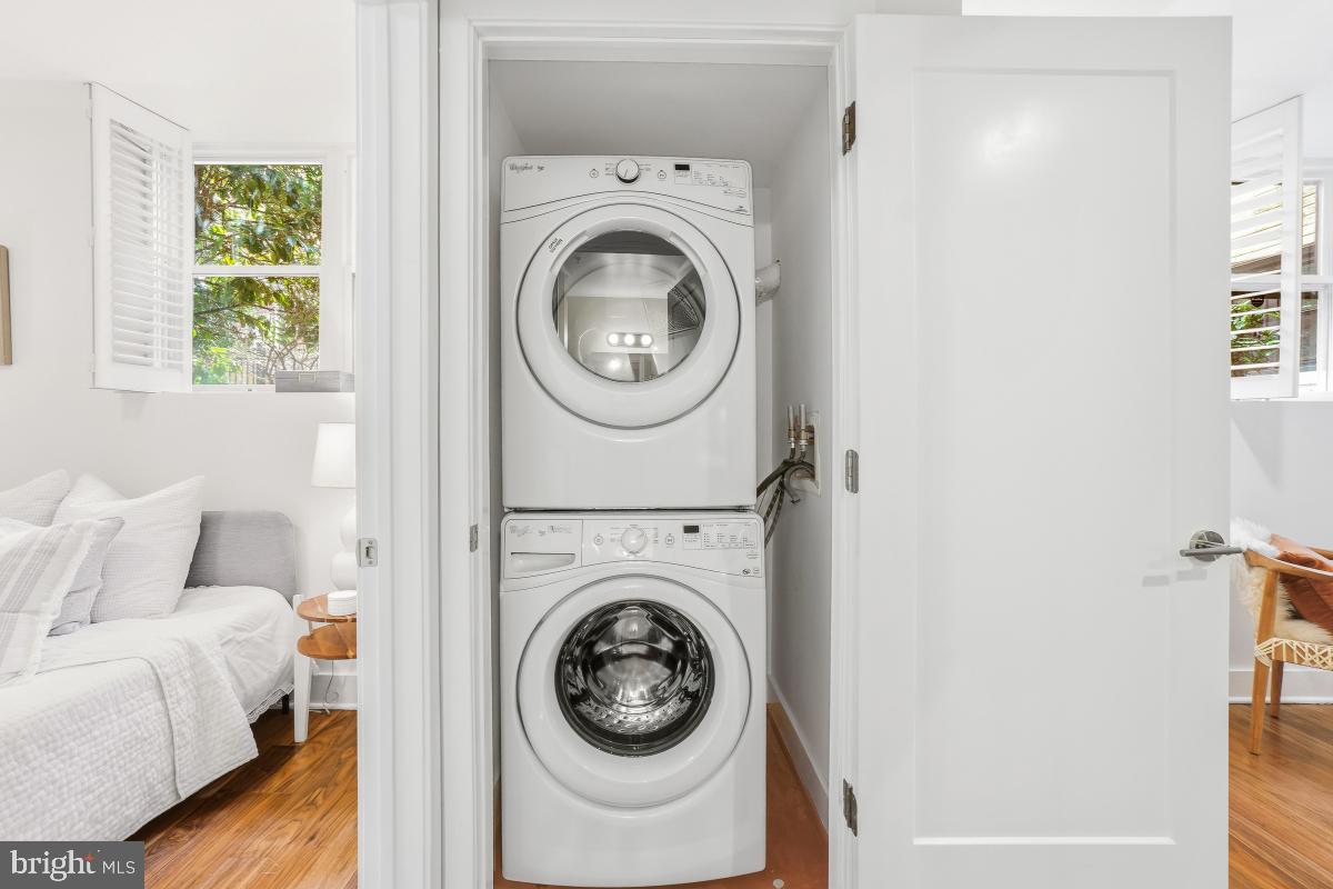 2331 15th Street Northwest, Unit 108N Washington, DC 20009 - Photo 15 of 25 a view of a bedroom with washer and dryer