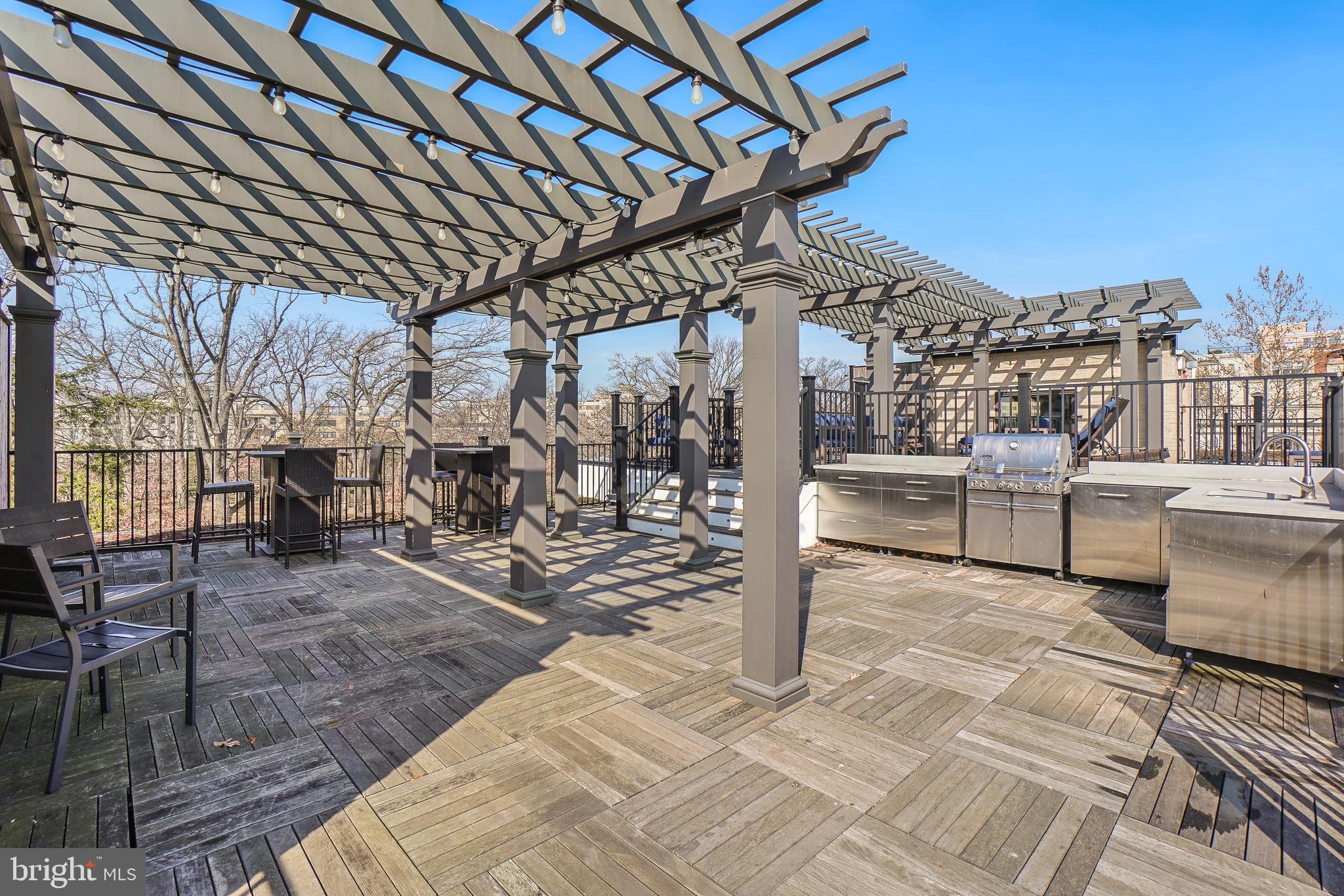 2331 15th Street Northwest, Unit 108N Washington, DC 20009 - Photo 17 of 25 a view of a patio with a table and chairs