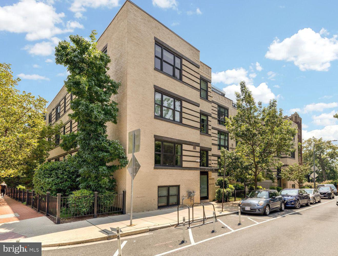 2331 15th Street Northwest, Unit 108N Washington, DC 20009 - Photo 23 of 25 a front view of a building with parked cars