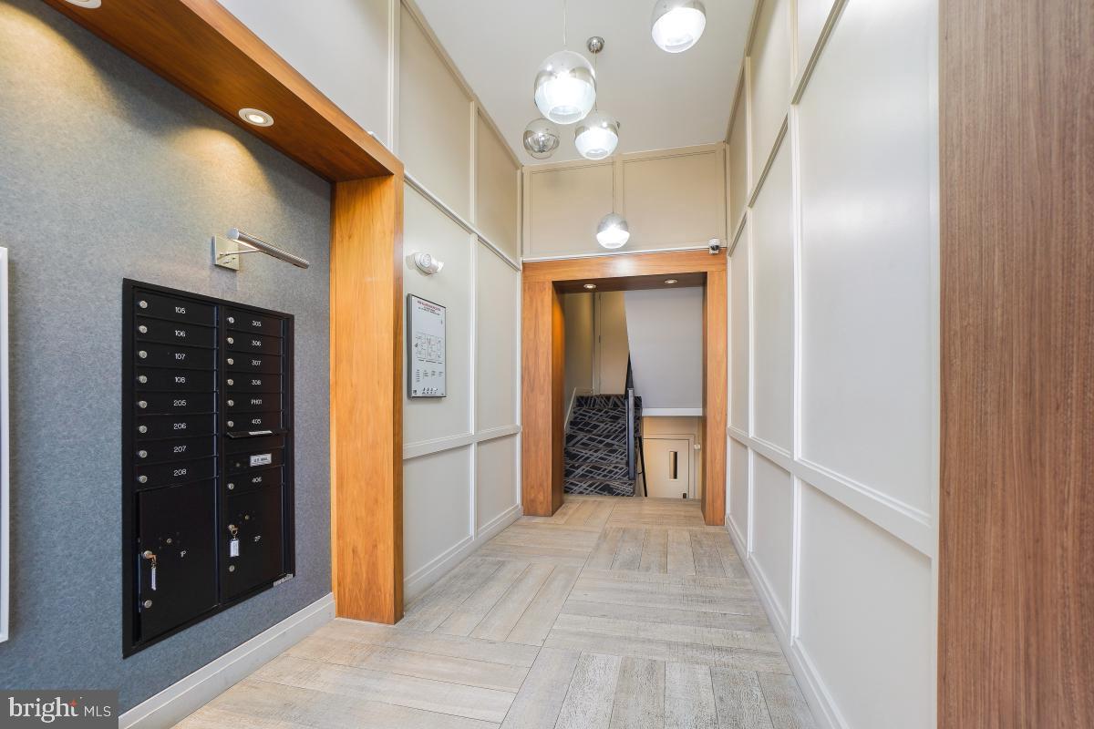 2331 15th Street Northwest, Unit 108N Washington, DC 20009 - Photo 24 of 25 a view of a hallway with wooden shelves