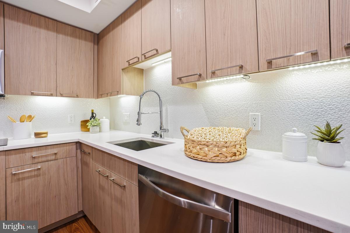 2331 15th Street Northwest, Unit 108N Washington, DC 20009 - Photo 3 of 25 a kitchen with a sink and cabinets