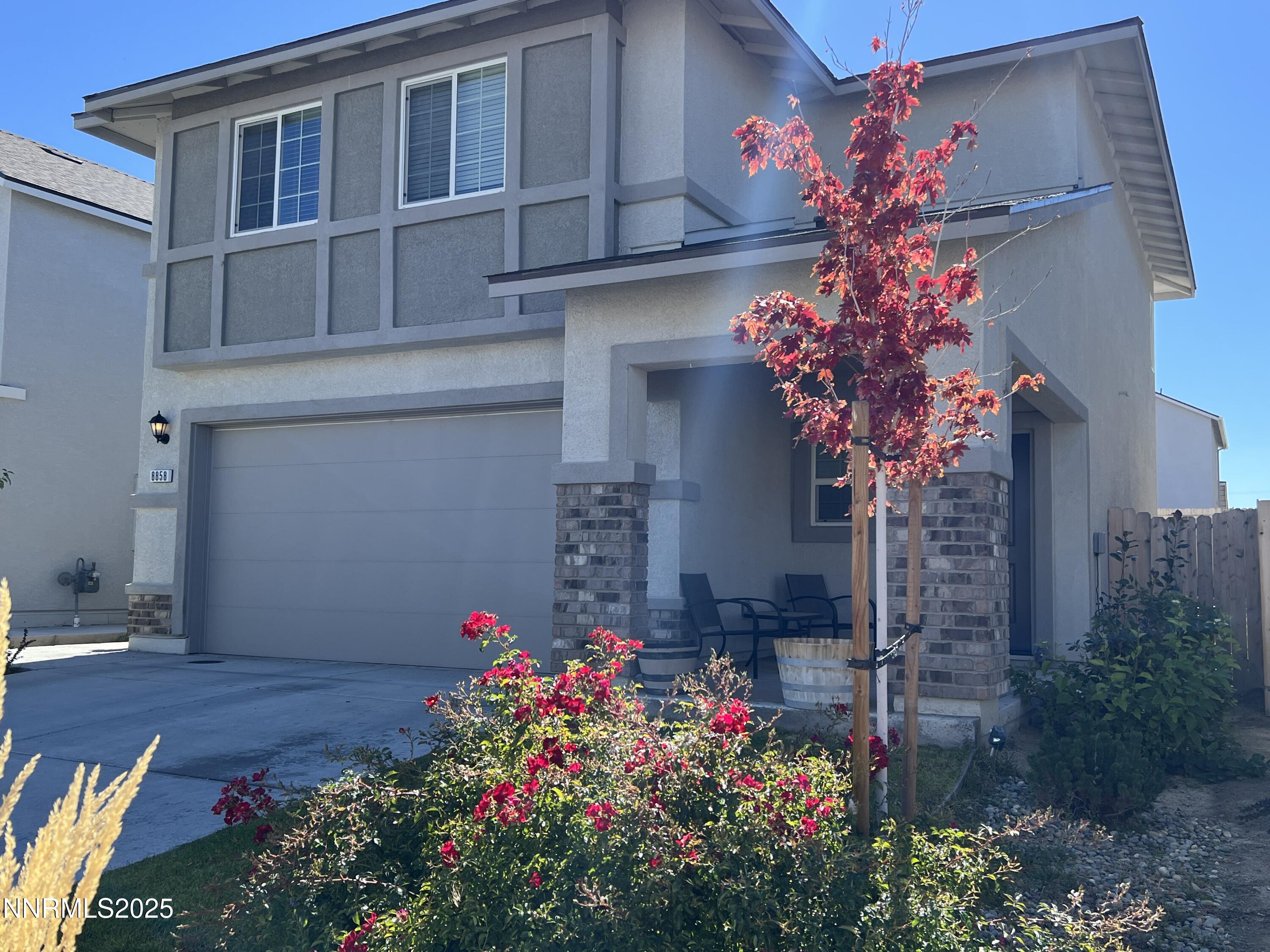 a flower plants in front of a house