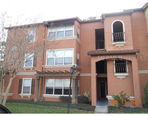 5148 Conroy Road, Unit 21 Orlando, FL 32811 - Photo 1 of 1 a front view of a house with a yard