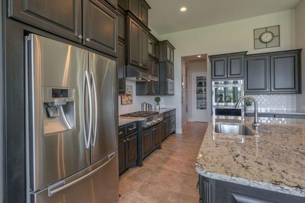 26519 Ashley Ridge Lane Katy, TX 77494 - Photo 11 of 28 a large kitchen with stainless steel appliances granite countertop a refrigerator a oven and a sink