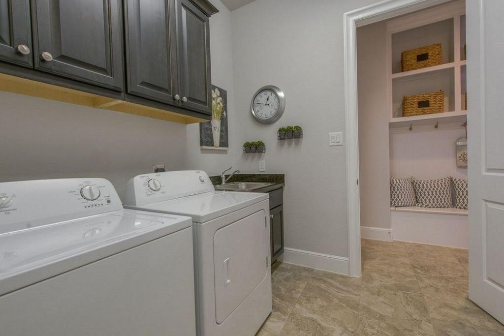 26519 Ashley Ridge Lane Katy, TX 77494 - Photo 14 of 28 a utility room with dryer and washer