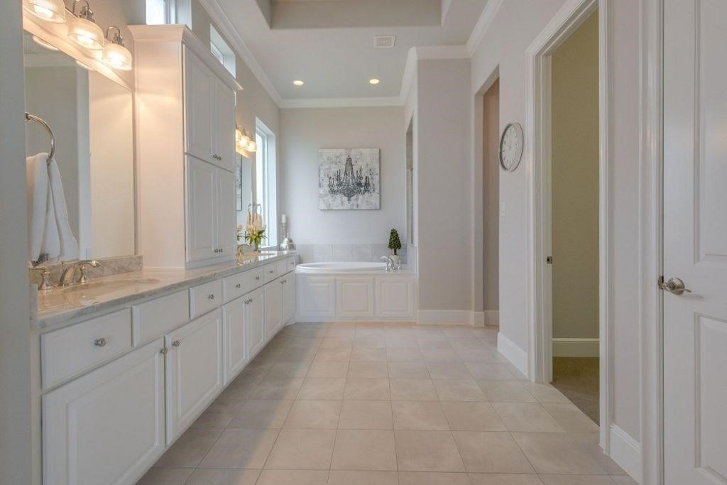 26519 Ashley Ridge Lane Katy, TX 77494 - Photo 16 of 28 a spacious bathroom with a mirror a double vanity sink and a mirror