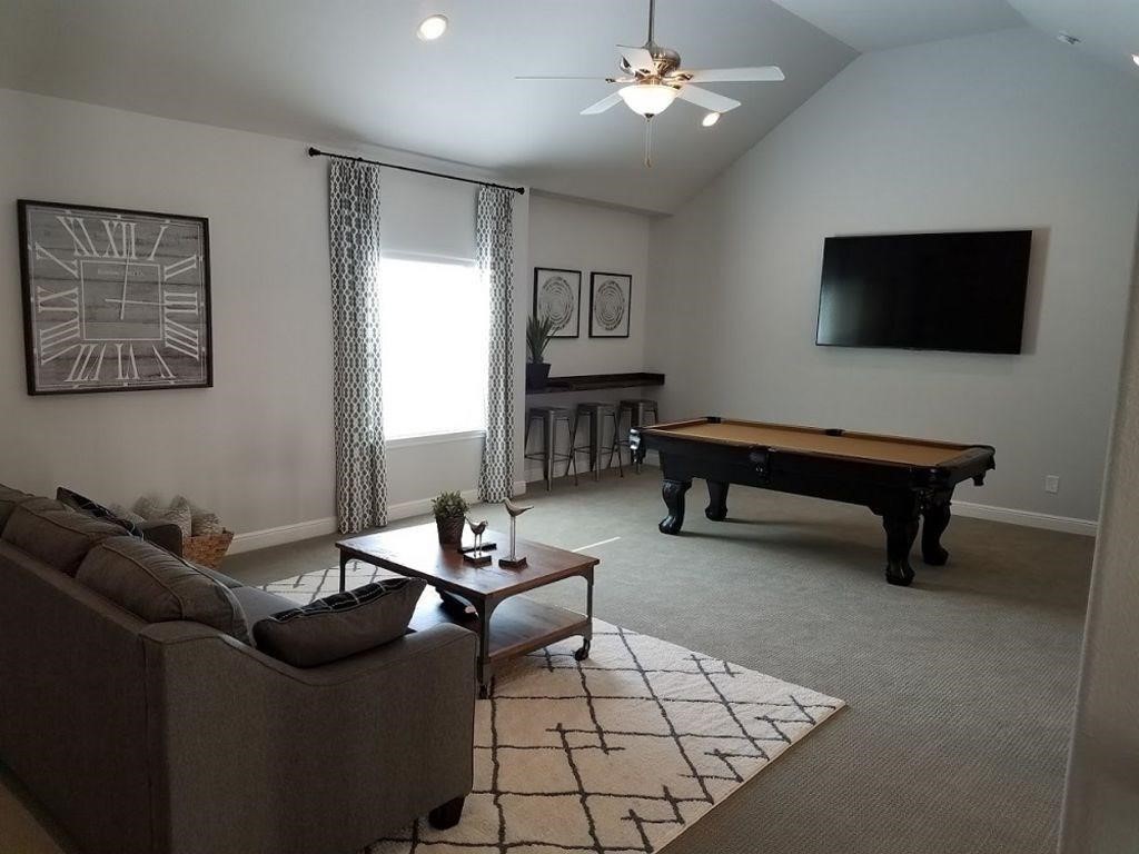 26519 Ashley Ridge Lane Katy, TX 77494 - Photo 19 of 28 a living room with furniture and a flat screen tv