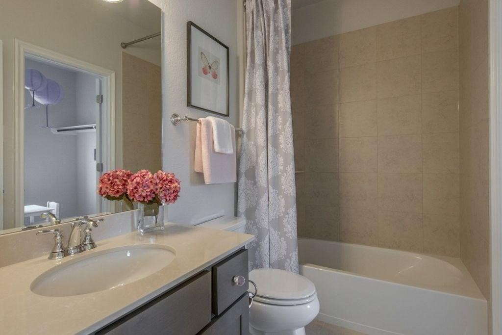 26519 Ashley Ridge Lane Katy, TX 77494 - Photo 21 of 28 a bathroom with a granite countertop sink toilet and shower