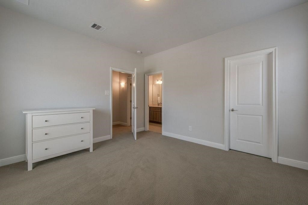 26519 Ashley Ridge Lane Katy, TX 77494 - Photo 22 of 28 a view of an empty room with a kitchen