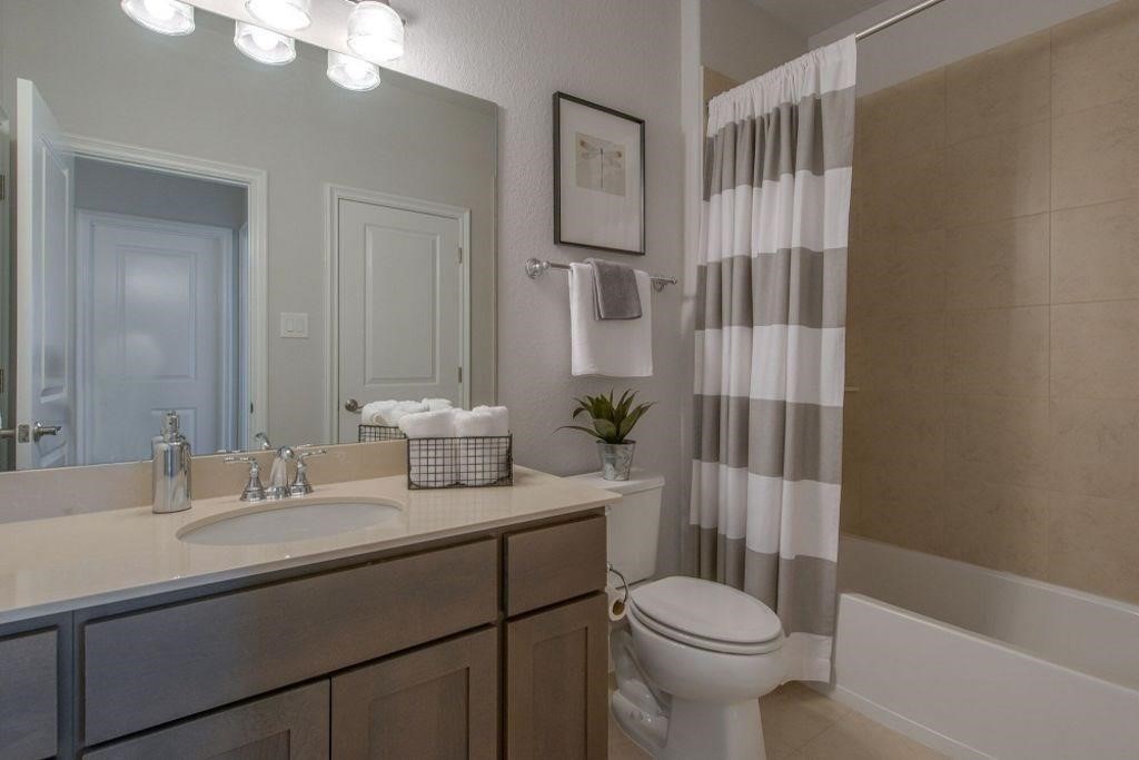 26519 Ashley Ridge Lane Katy, TX 77494 - Photo 23 of 28 a bathroom with a sink toilet and shower