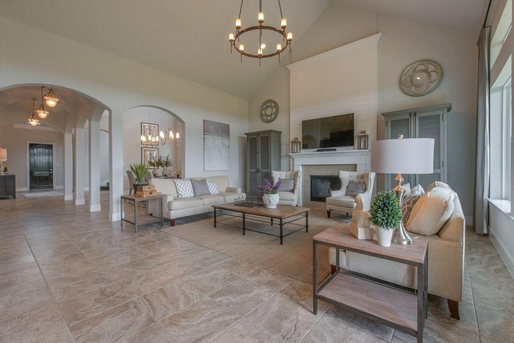 26519 Ashley Ridge Lane Katy, TX 77494 - Photo 6 of 28 a living room with furniture a flat screen tv and a fireplace