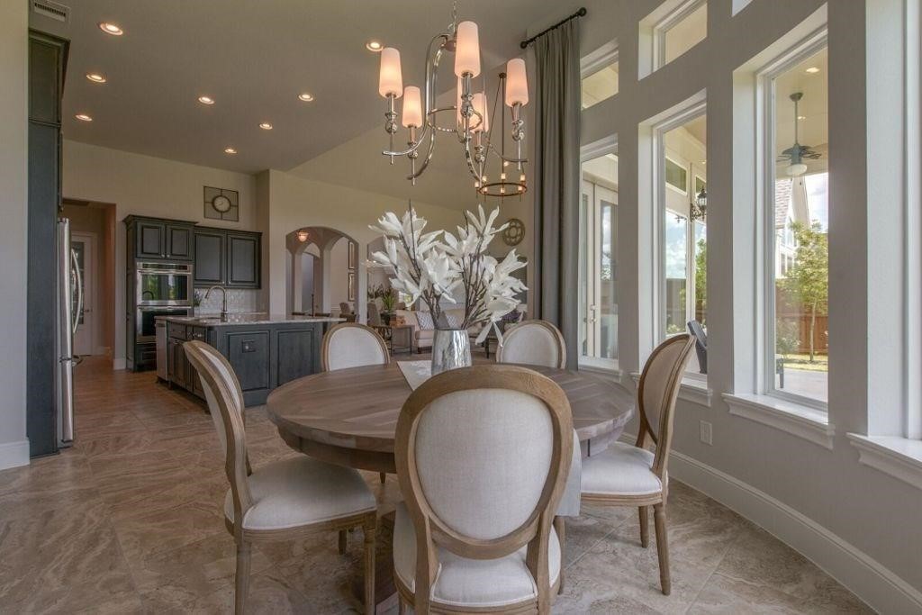 26519 Ashley Ridge Lane Katy, TX 77494 - Photo 8 of 28 a dining room with furniture a chandelier and wooden floor