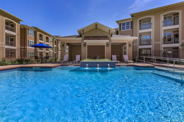 a front view of a building with garden